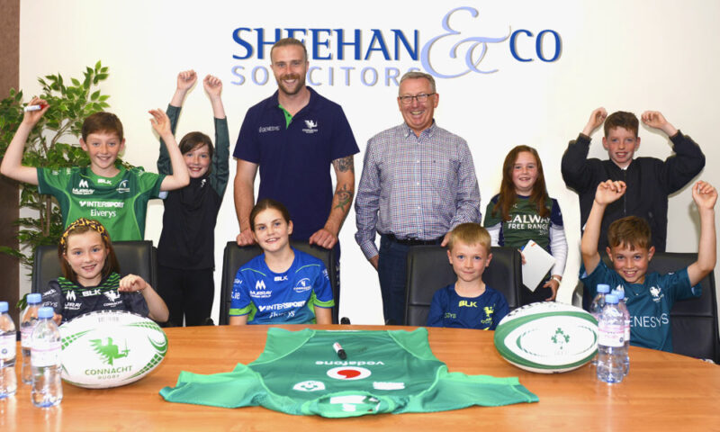 Irish International player Mack Hansen in Sheehan and Co. Solicitors in Galway, meeting children of the staff.